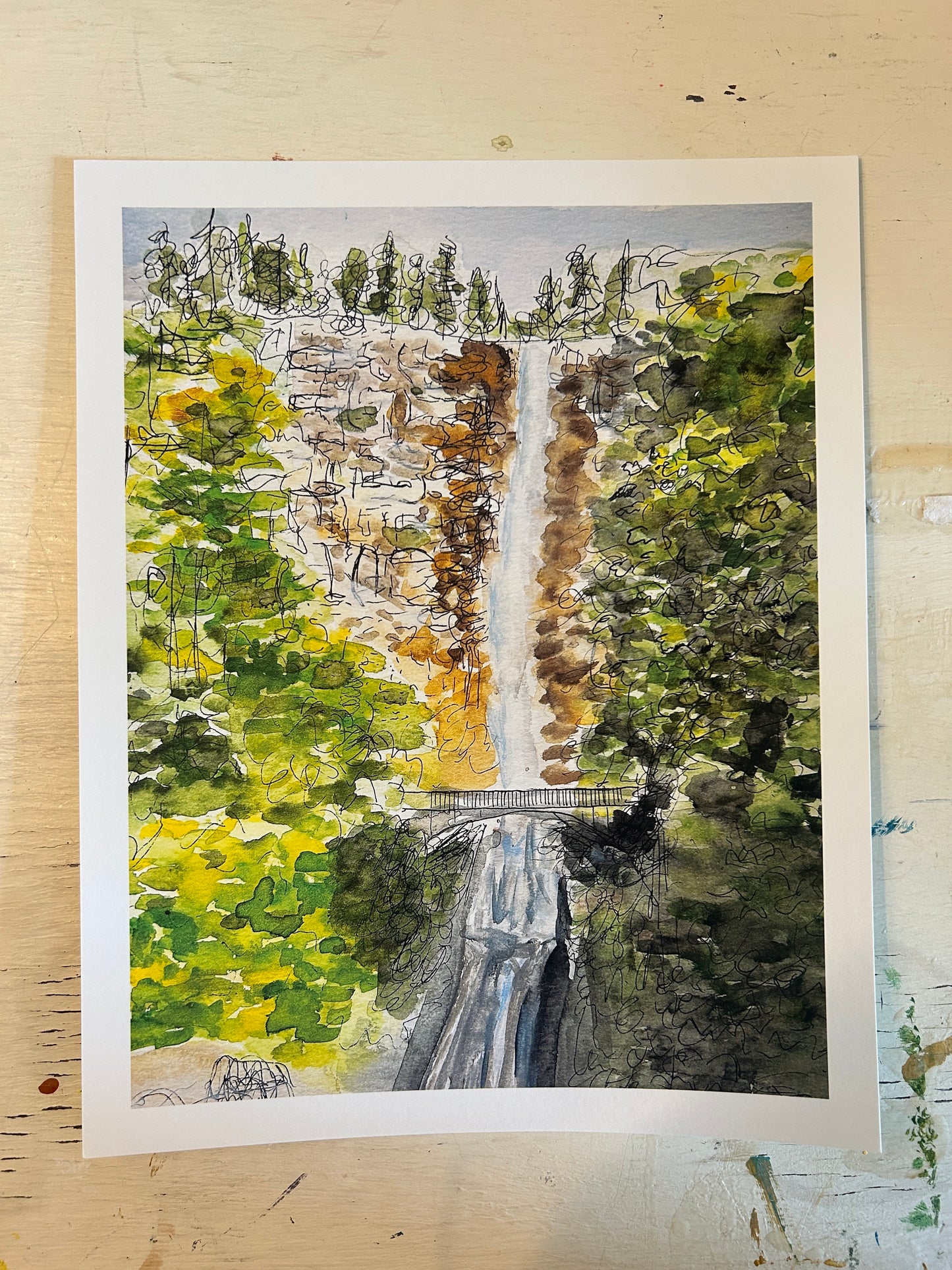 "a bridge and a waterfall"